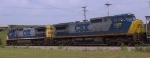 CSX 7907 & 7357 bring a train through town